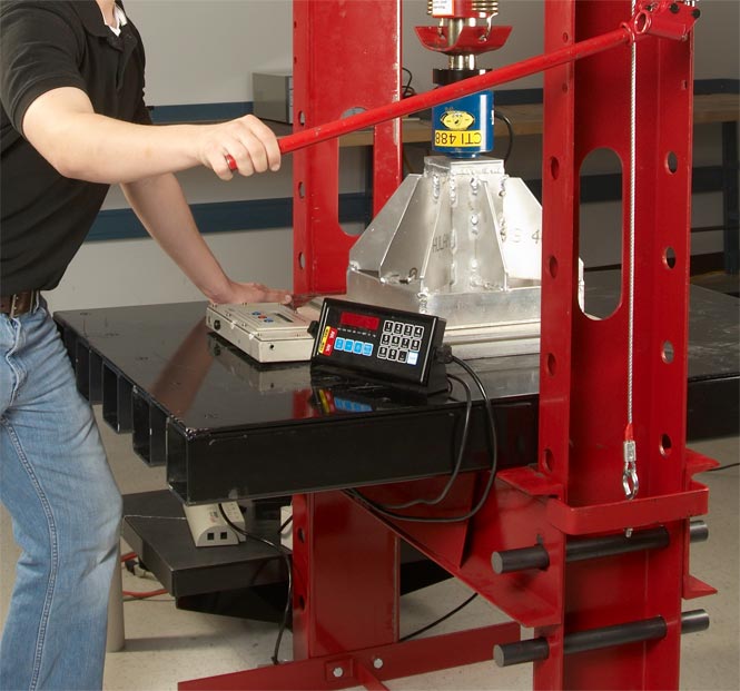 worker using a press machine